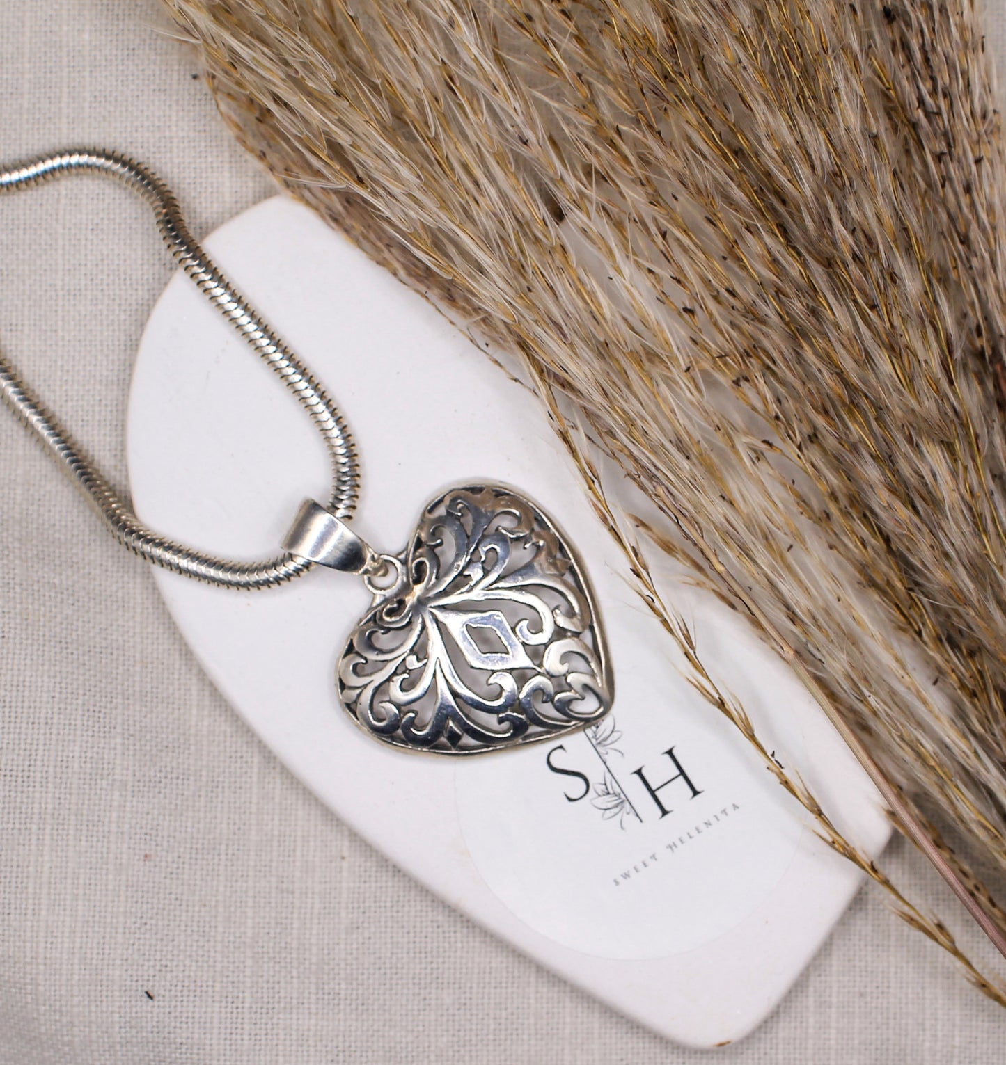 Silver Horn Necklace with Intricately Crafted Heart Pendant